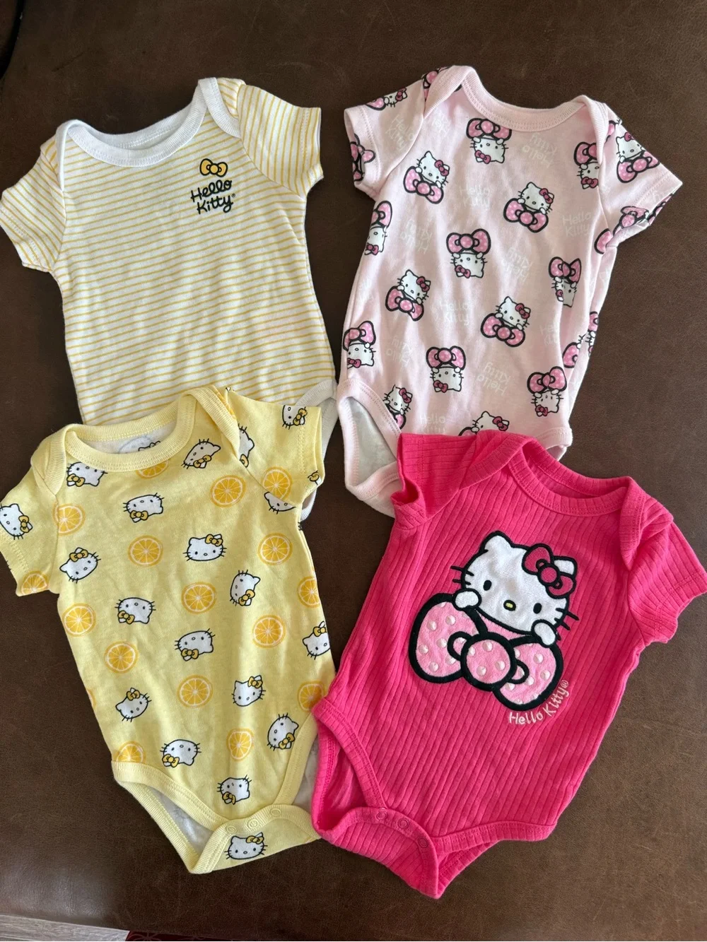 Hello Kitty Girls' Short Sleeve One-Piece Bodysuit - Pink, Yellow, Light Pink